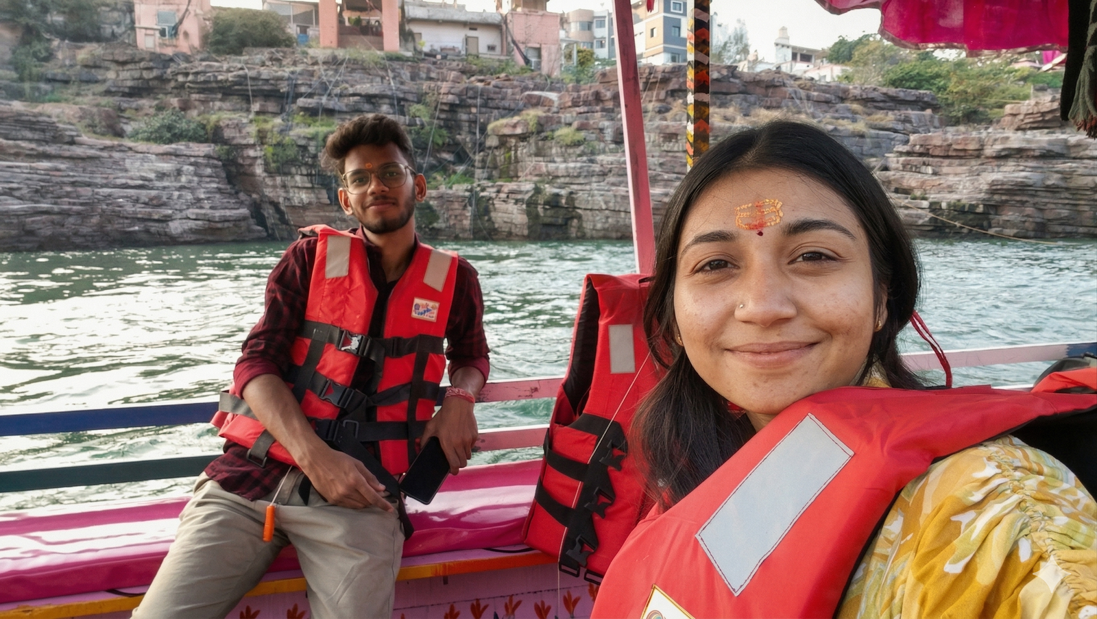 Riya and me smiling on a boat