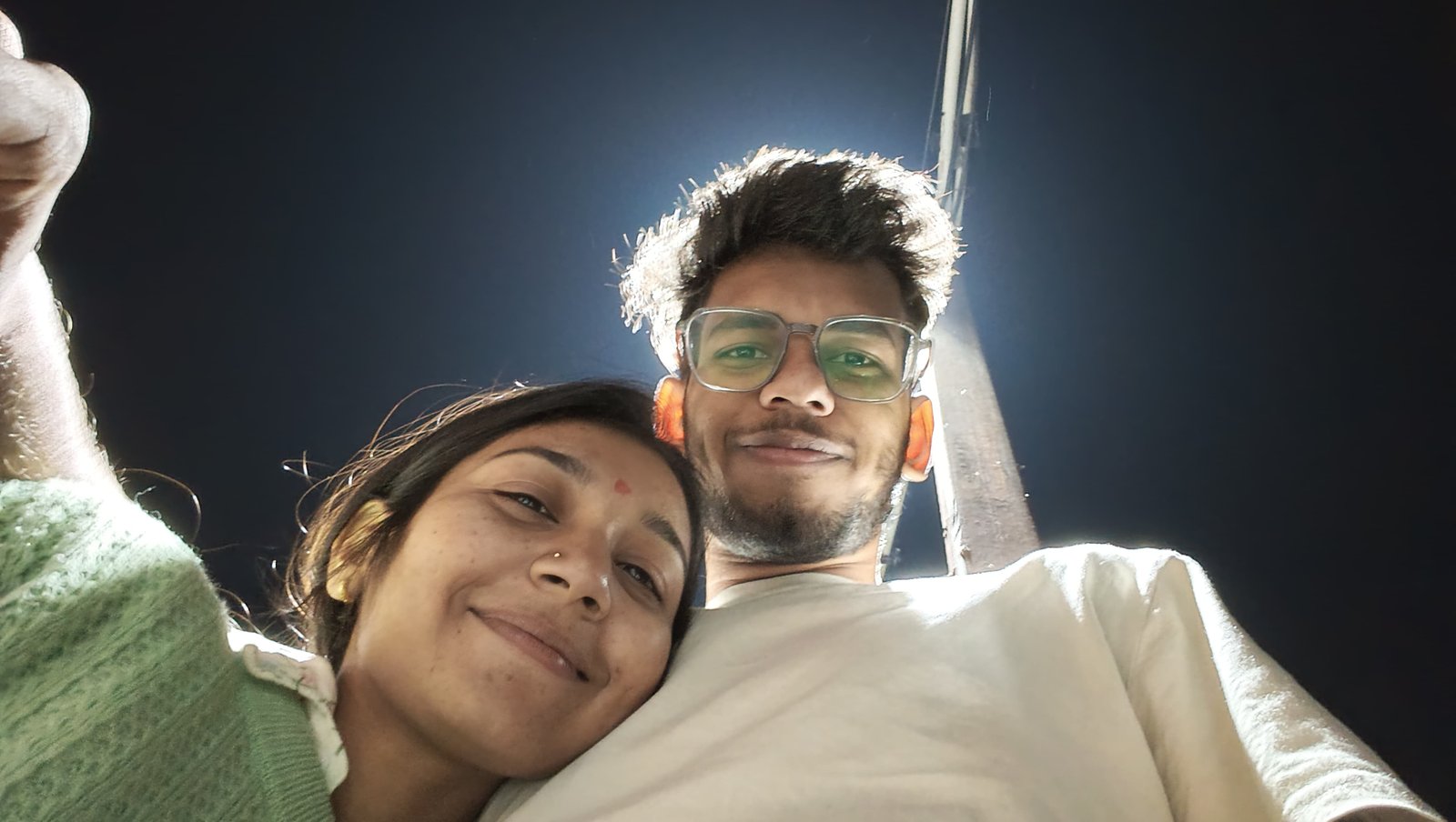 Riya and me smiling at night